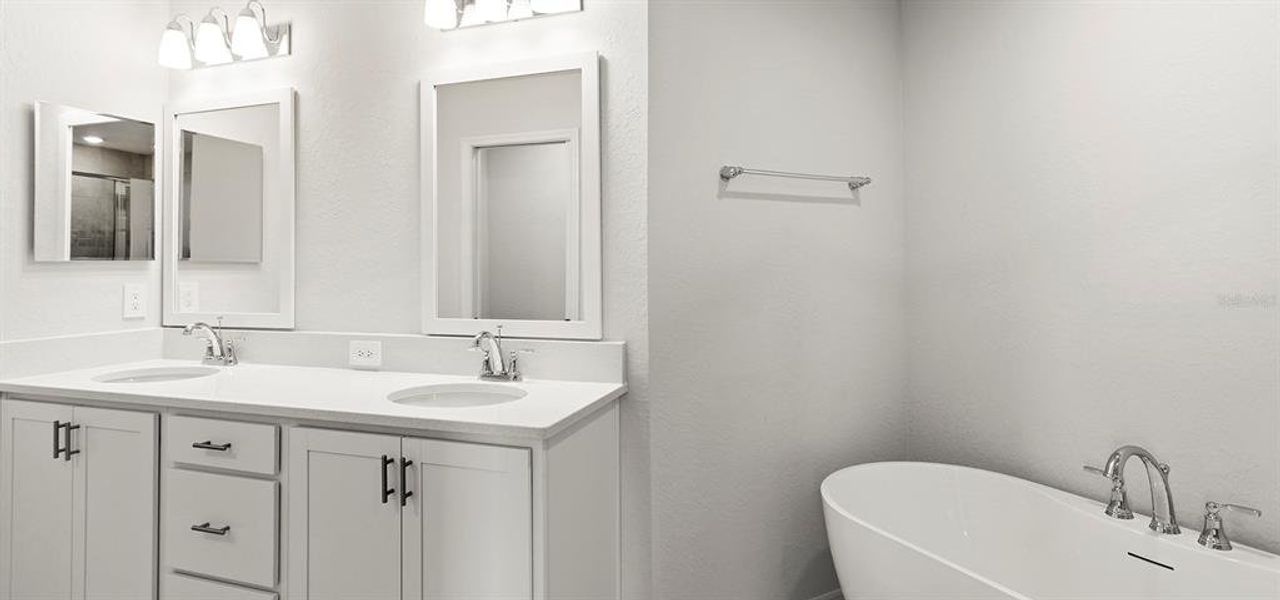 Furnished interior view inside a new home in Estates at Hickory Cove - Bungalows, St. Cloud (Image 11).