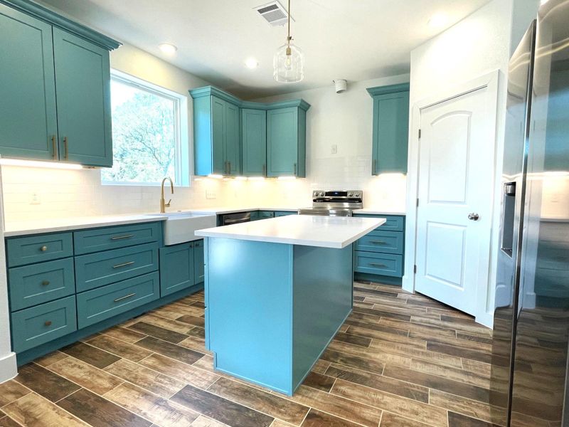 Kitchen with island and pantry