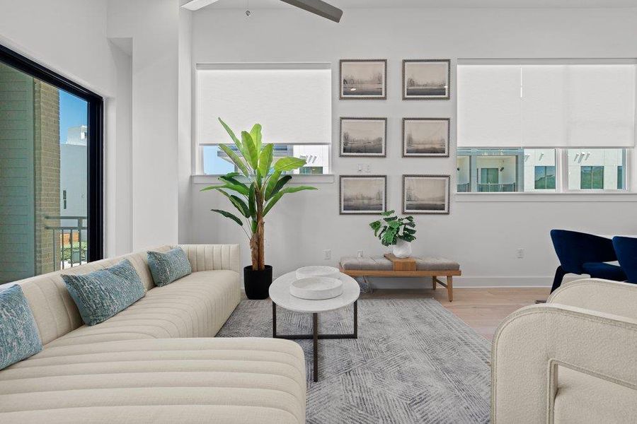 Sun-filled living space offers seamless indoor-outdoor living through expansive glass doors. Sun-filled living space offers seamless indoor-outdoor living through expansive glass doors.