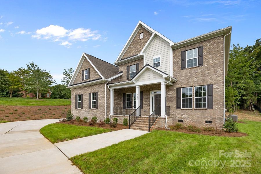 Front exterior of a new home in Stonebridge, Mint Hill, NC, highlighting curb appeal (Image 18). Front exterior of a new home in Stonebridge, Mint Hill, NC, highlighting curb appeal (Image 18).