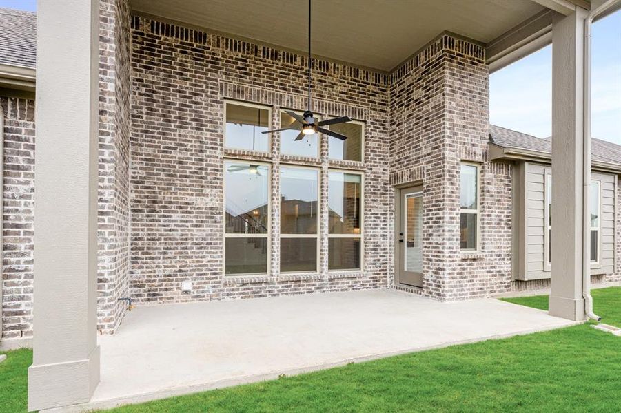 Exterior details and patio area of a home in Villages of Hurricane Creek, Anna (Image 4).
