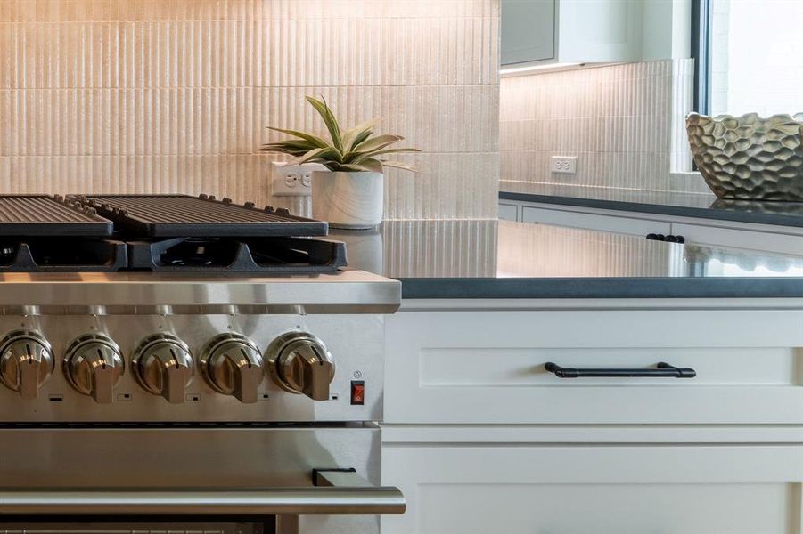 Kitchen view of dark countertops Kitchen view of dark countertops