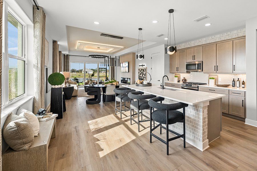 Representative furnished interior of a home built from the Regatta by Homes by Towne in Shellstone at Waterside, Sarasota (Image 8).