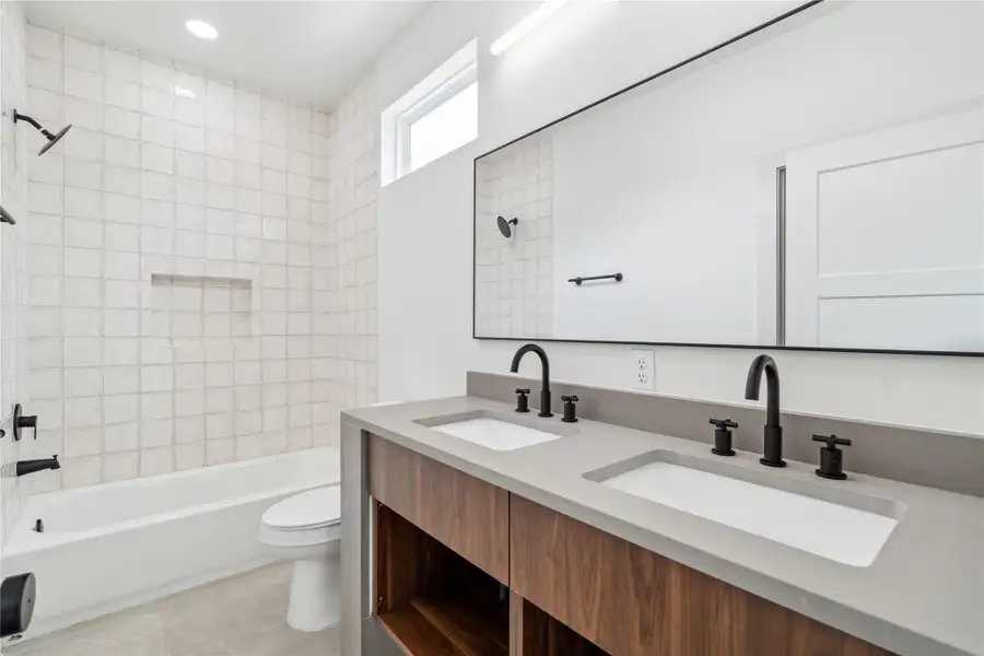 Dual sinks in the secondary en suite offer a blend of luxury and everyday ease—perfect for sharing without sacrificing comfort. Dual sinks in the secondary en suite offer a blend of luxury and everyday ease—perfect for sharing without sacrificing comfort.