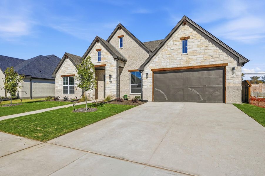 Front exterior of a new home in LeTara, Haslet, TX, highlighting curb appeal (Image 21). Front exterior of a new home in LeTara, Haslet, TX, highlighting curb appeal (Image 21).