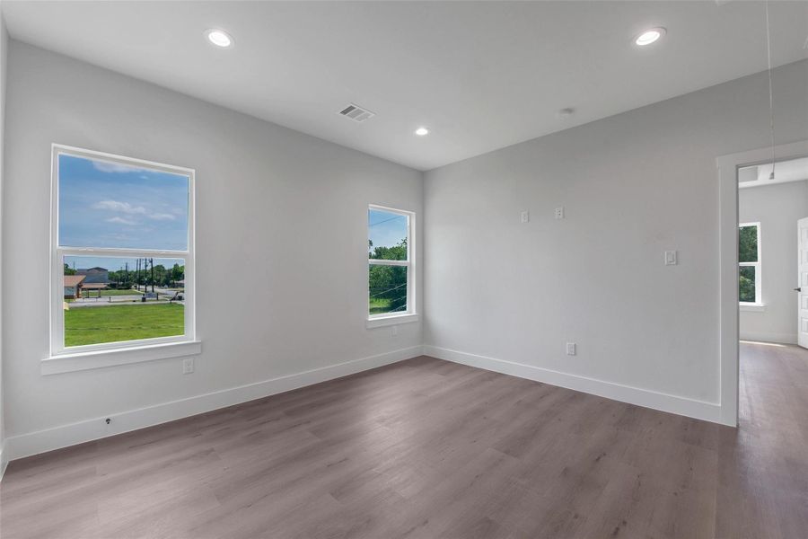 Another angle of the flexible upstairs space, showcasing its open feel and the convenient doorway leading directly to the primary suite. Another angle of the flexible upstairs space, showcasing its open feel and the convenient doorway leading directly to the primary suite.