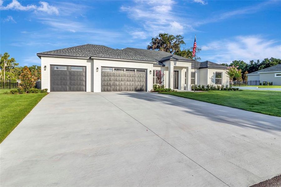 Front exterior of a new home in , Montverde, FL, highlighting curb appeal (Image 24). Front exterior of a new home in , Montverde, FL, highlighting curb appeal (Image 24).