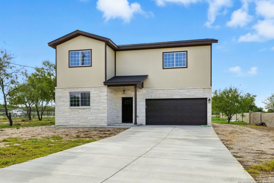 Front exterior of a new home in , Lytle, TX, highlighting curb appeal (Image 18). Front exterior of a new home in , Lytle, TX, highlighting curb appeal (Image 18).