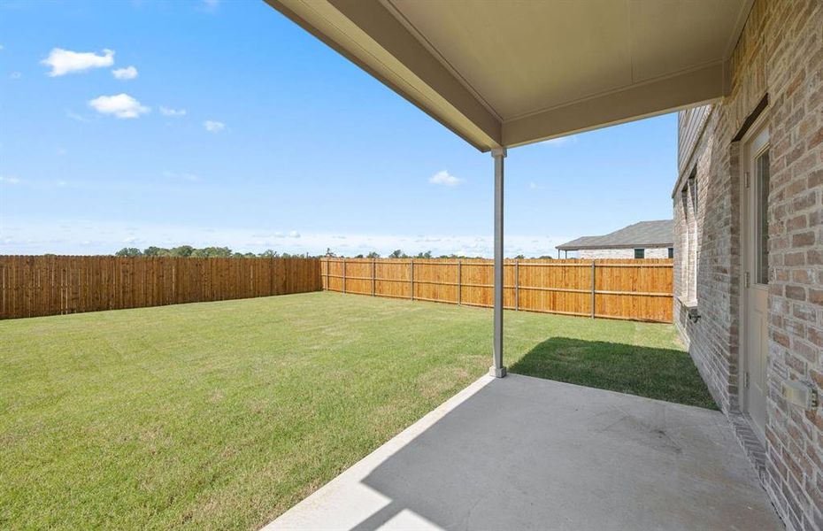 Large fenced in backyard with covered patio Large fenced in backyard with covered patio