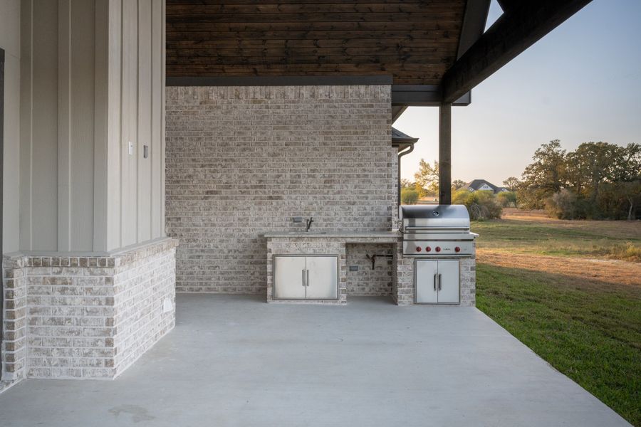 Exterior details and patio area of a home in Windmill Hill, Bryan (Image 33).