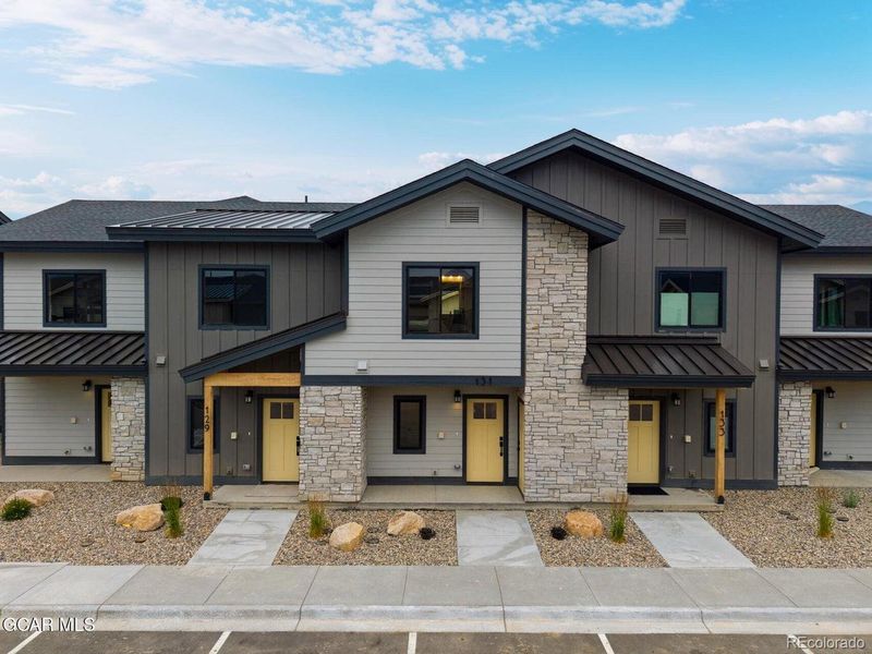 Front exterior of a new home in , Granby, CO, highlighting curb appeal (Image 28). Front exterior of a new home in , Granby, CO, highlighting curb appeal (Image 28).