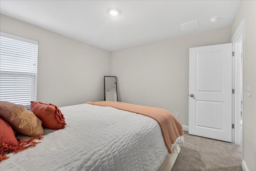 Furnished interior view inside a new home in Jasmine Point at Lakes of Cane Bay, Summerville (Image 16).