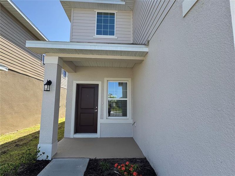 Front exterior of a new home in Harmony Central, Harmony, FL, highlighting curb appeal (Image 22). Front exterior of a new home in Harmony Central, Harmony, FL, highlighting curb appeal (Image 22).