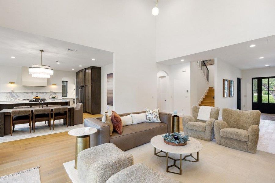 Natural light illuminates this open-concept living space, blending modern design with functional family living. Natural light illuminates this open-concept living space, blending modern design with functional family living.