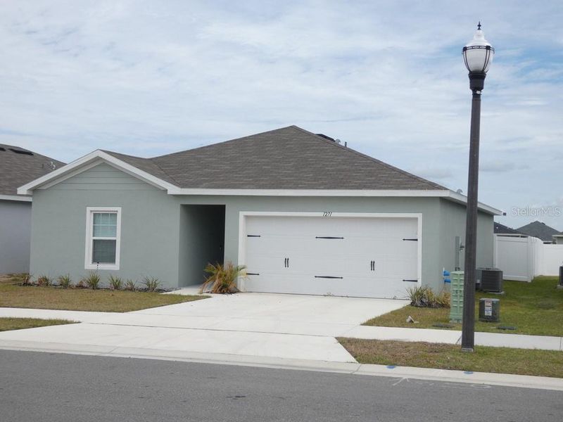 Front exterior of a new home in , Haines City, FL, highlighting curb appeal (Image 23). Front exterior of a new home in , Haines City, FL, highlighting curb appeal (Image 23).