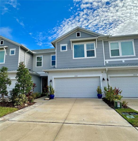 Front exterior of a new home in , Land O' Lakes, FL, highlighting curb appeal (Image 1). Front exterior of a new home in , Land O' Lakes, FL, highlighting curb appeal (Image 1).