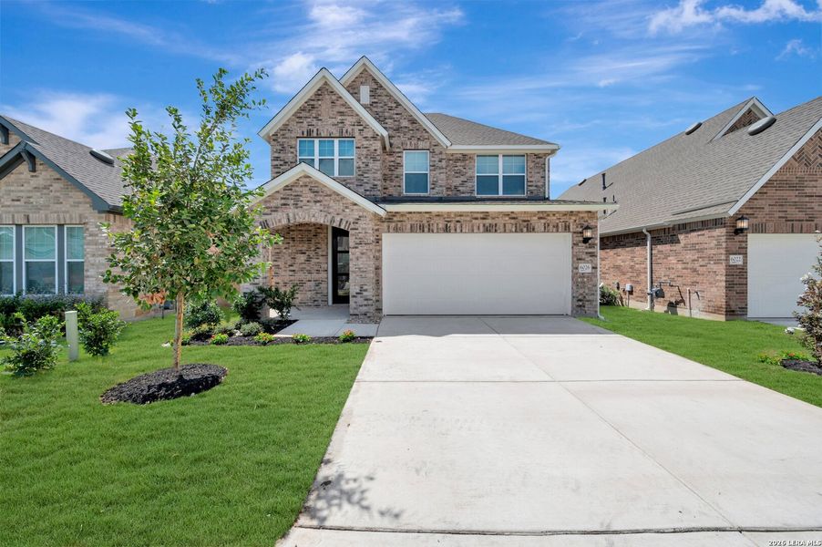 Front exterior of a new home in Mayfair - Select Garden Series, New Braunfels, TX, highlighting curb appeal (Image 1). Front exterior of a new home in Mayfair - Select Garden Series, New Braunfels, TX, highlighting curb appeal (Image 1).