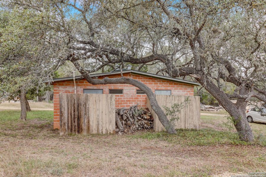 Front exterior of a new home in , Bandera, TX, highlighting curb appeal (Image 22).