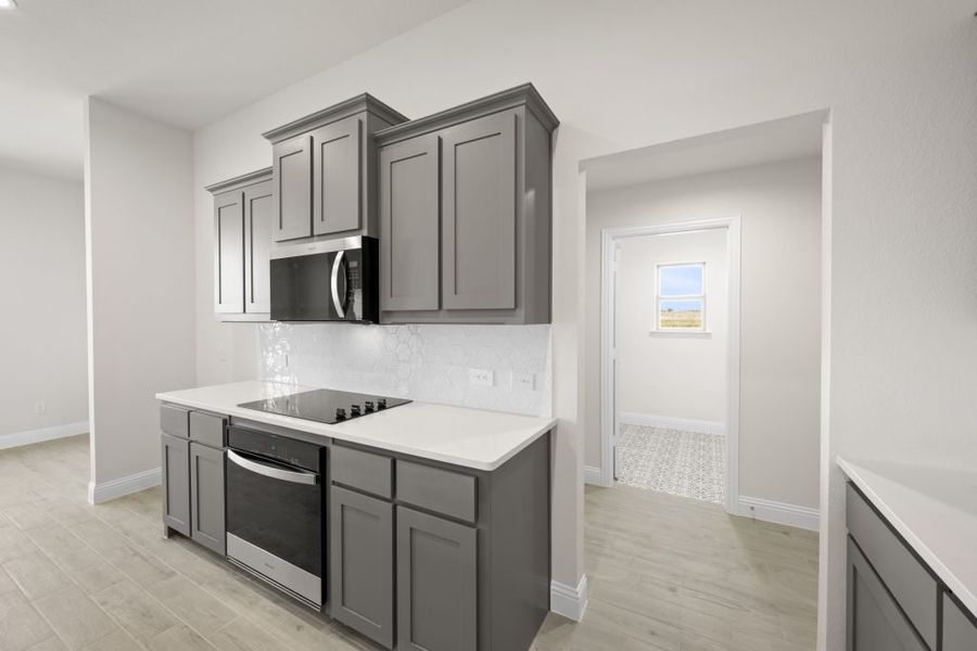 Front exterior of a new home in Still Water Lake, Godley, TX, highlighting curb appeal (Image 9). Front exterior of a new home in Still Water Lake, Godley, TX, highlighting curb appeal (Image 9).