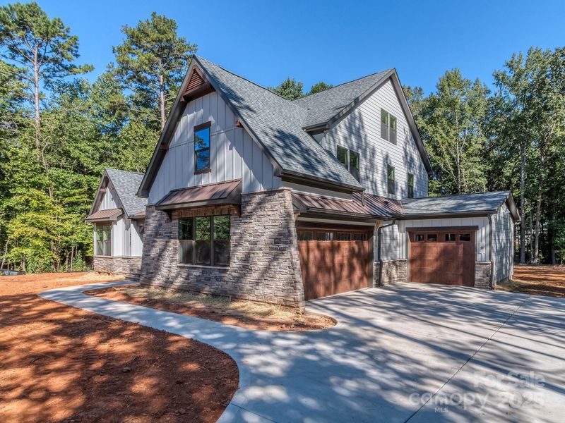 Front exterior of a new home in , Matthews, NC, highlighting curb appeal (Image 25).