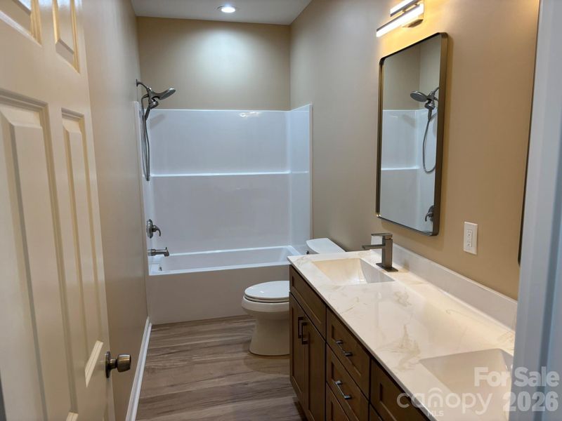 Guest bath is convenient to the guest bedrooms and living room.