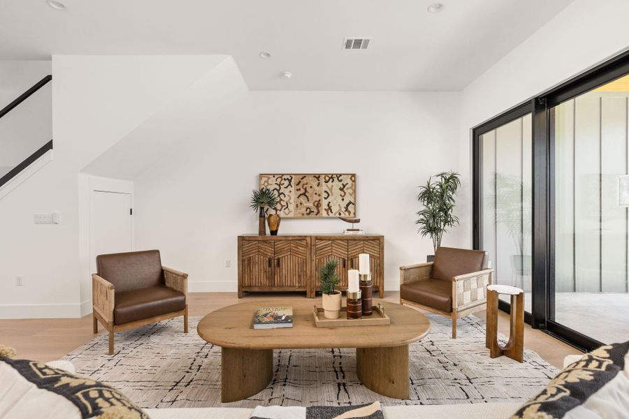 Sitting room featuring wood finished floors and recessed lighting