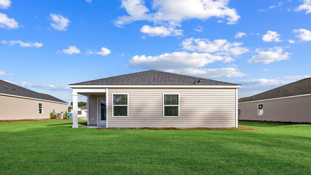 Exterior details and patio area of a home in The Groves at Bees Creek, Ridgeland (Image 3).