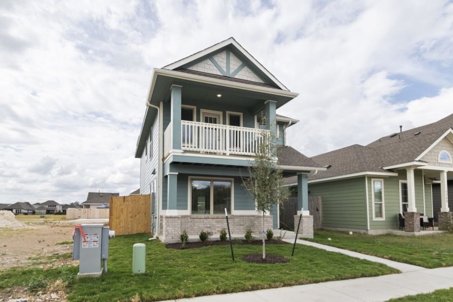 Front exterior of a new home in Blanco Vista, San Marcos, TX, highlighting curb appeal (Image 13).