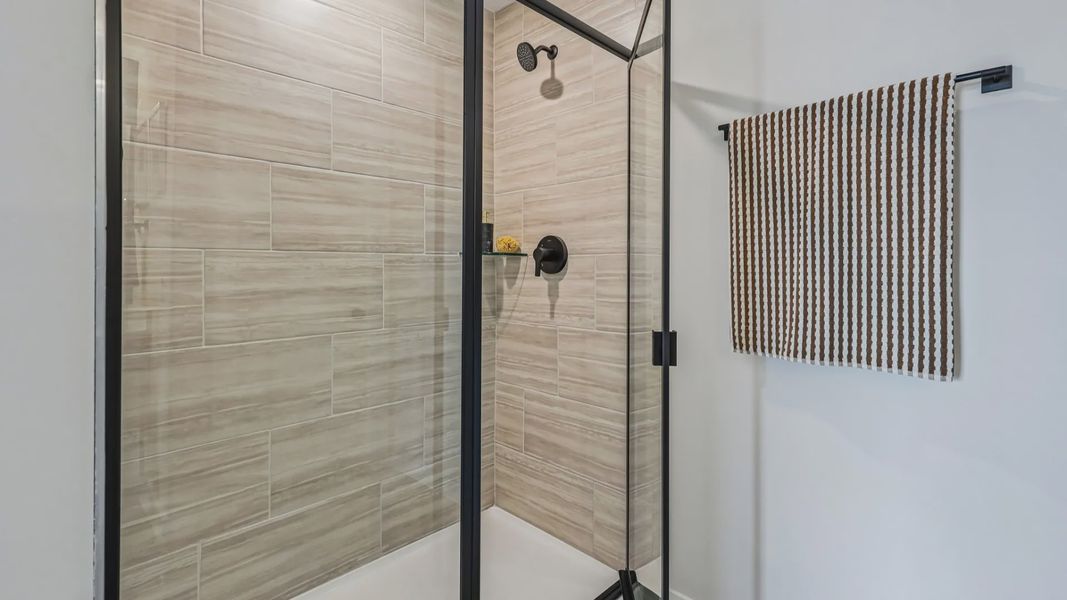 Primary bathroom with glass-enclosed shower