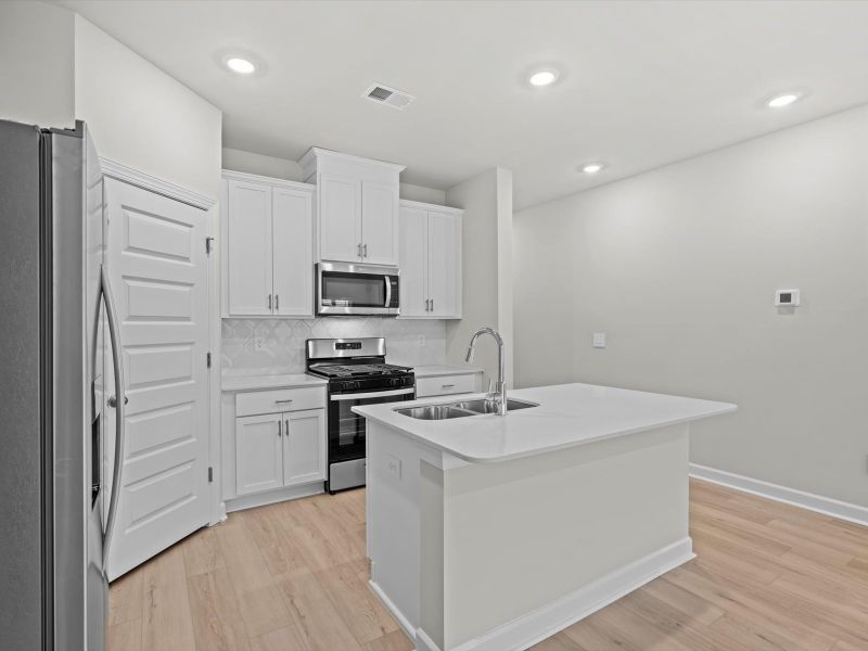 Furnished interior view inside a new home in Crossing at Abner Creek Townes, Greer (Image 5).