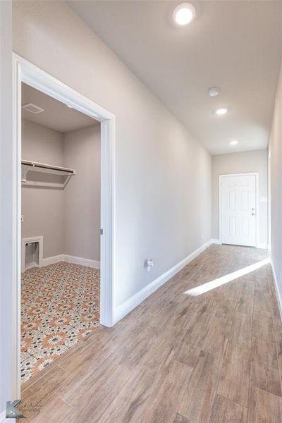 Spare room with recessed lighting and light wood-style flooring