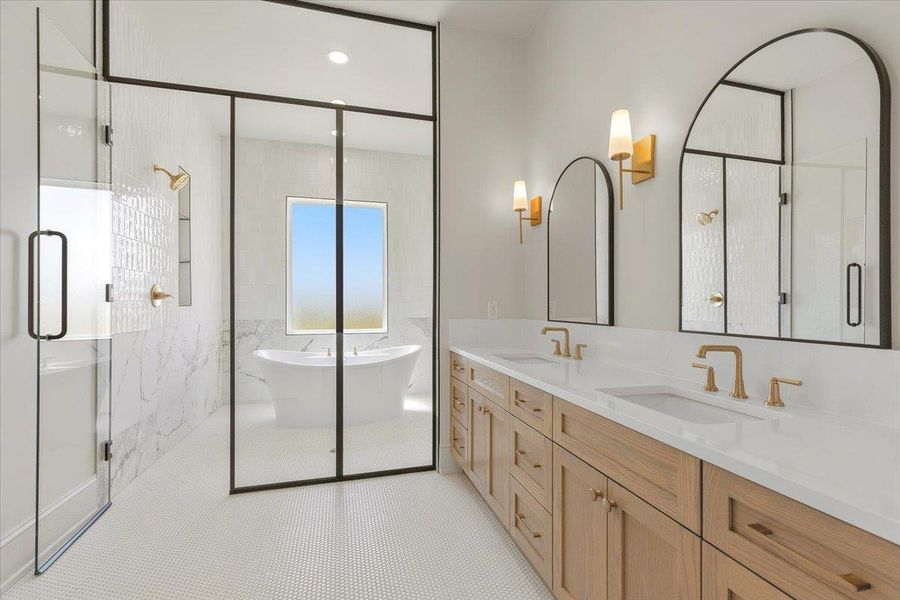 The luxurious primary bathroom features dual vanities, freestanding tub, and elegant tile work for a spa-like retreat. The luxurious primary bathroom features dual vanities, freestanding tub, and elegant tile work for a spa-like retreat.