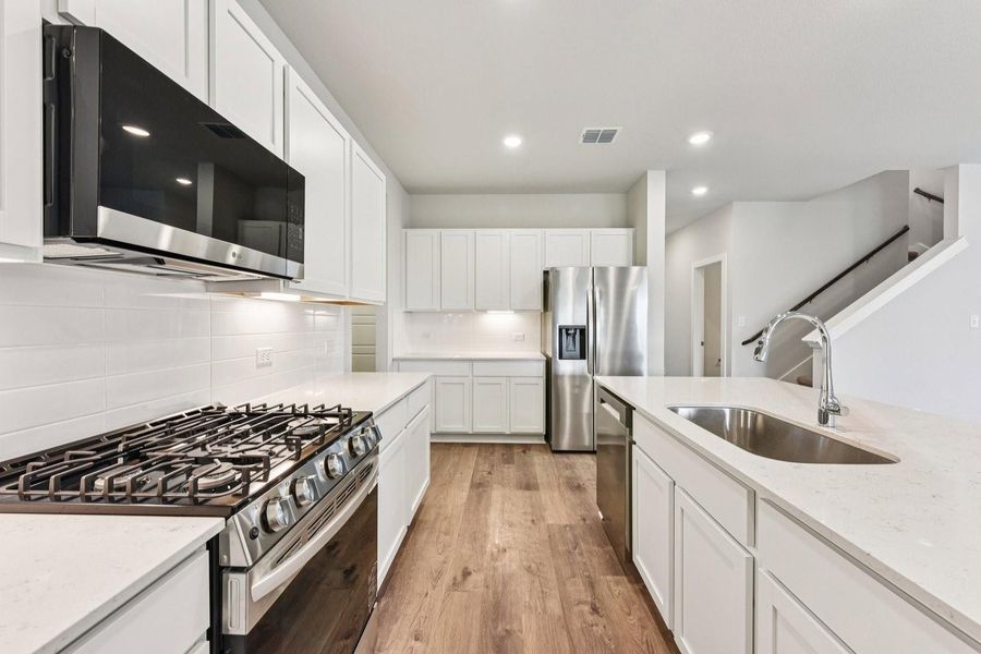 Furnished interior view inside a new home in Stallion Run, Buda (Image 16).