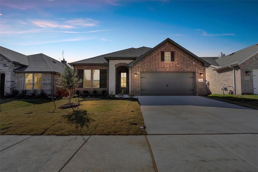 Front exterior of a new home in Northstar, Haslet, TX, highlighting curb appeal (Image 18).