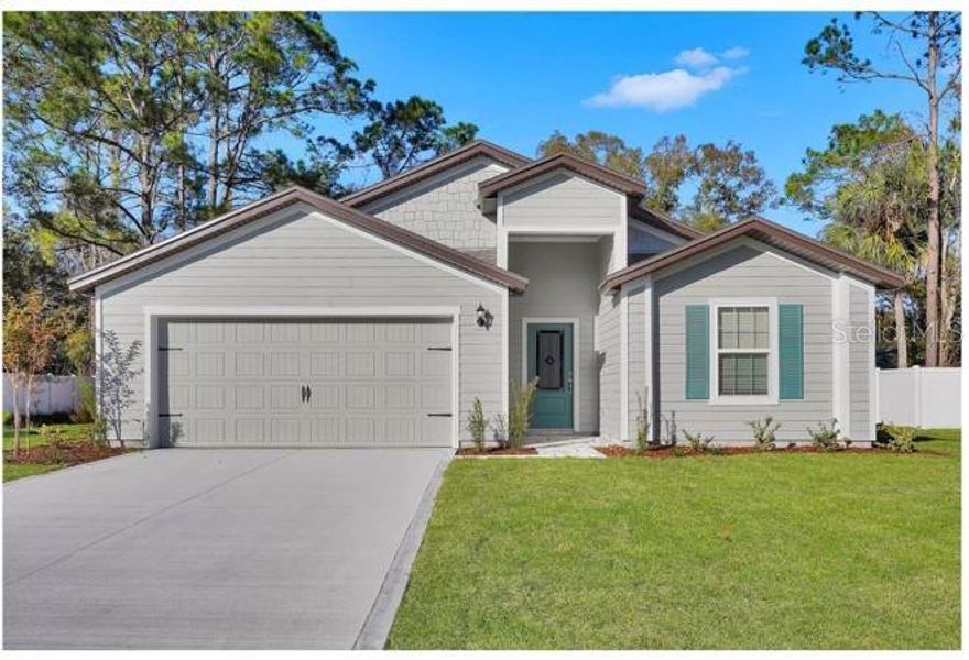 Front exterior of a new home in , Ocala, FL, highlighting curb appeal (Image 1).