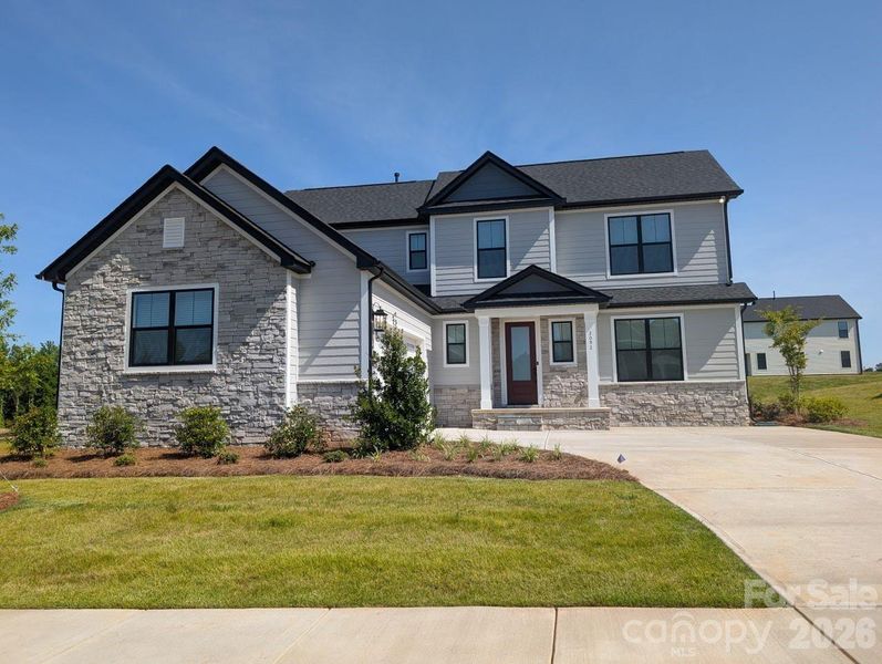 Front exterior of a new home in Stoneridge Hills, Rock Hill, SC, highlighting curb appeal (Image 2). Front exterior of a new home in Stoneridge Hills, Rock Hill, SC, highlighting curb appeal (Image 2).