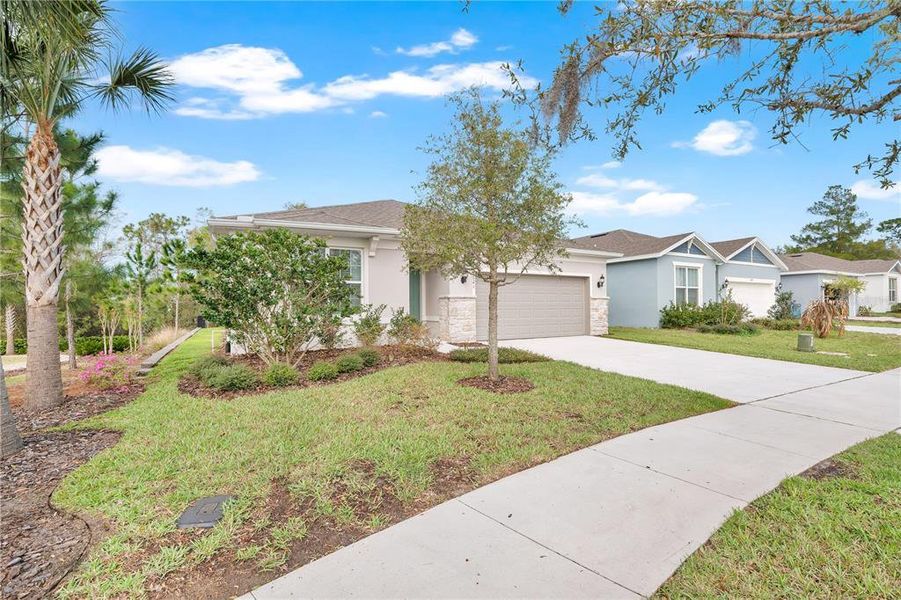 Front exterior of a new home in , Deland, FL, highlighting curb appeal (Image 22).