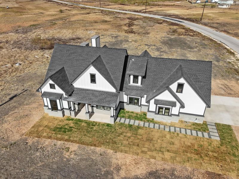 Front exterior of a new home in , Del Valle, TX, highlighting curb appeal (Image 2). Front exterior of a new home in , Del Valle, TX, highlighting curb appeal (Image 2).