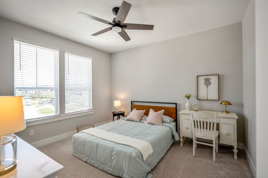 Another roomy, comfortable bedroom offers soft neutral finishes, a large walk-in closet, and ensuite access to a shared Hollywood style bathroom.