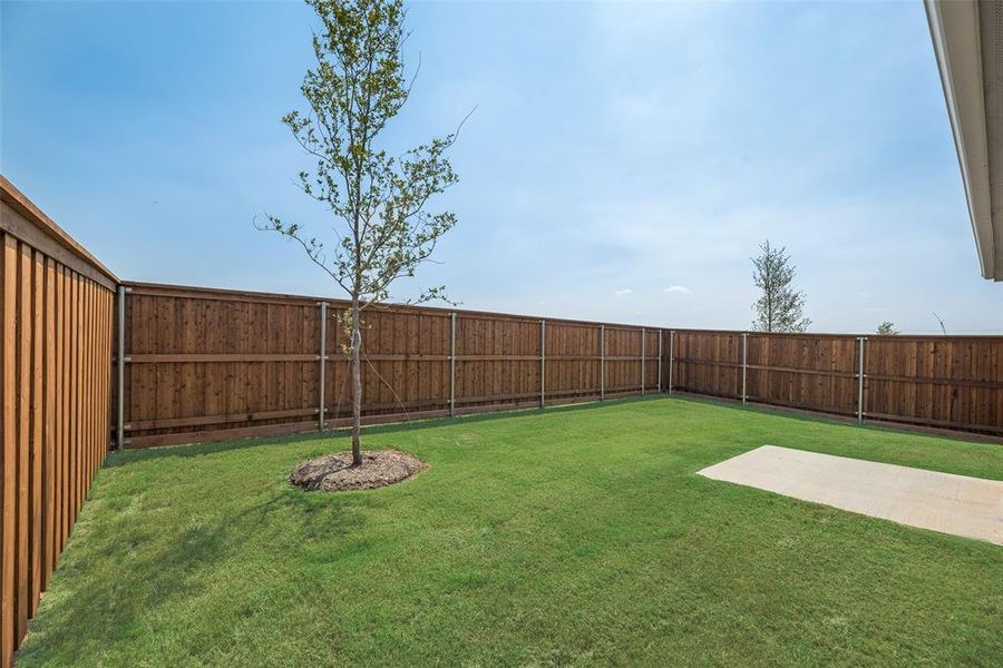 Front exterior of a new home in Spiritas Ranch, Little Elm, TX, highlighting curb appeal (Image 16). Front exterior of a new home in Spiritas Ranch, Little Elm, TX, highlighting curb appeal (Image 16).