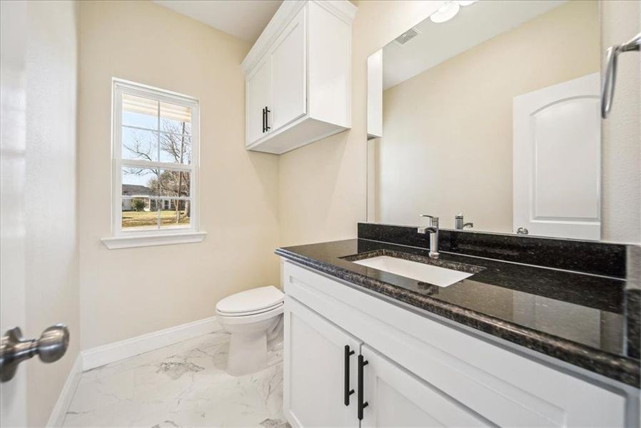 Bathroom with vanity and toilet