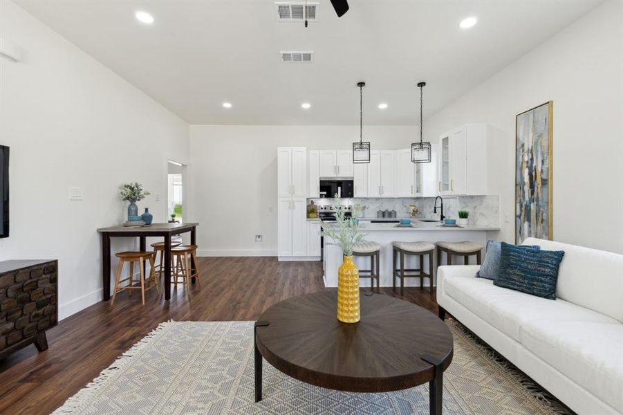 View of the entire great room with the living space, kitchen and breakfast room. View of the entire great room with the living space, kitchen and breakfast room.
