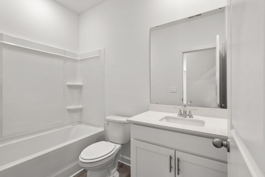 Furnished interior view inside a new home in Cypress Ridge - The Boardwalk Series, Longs (Image 11).