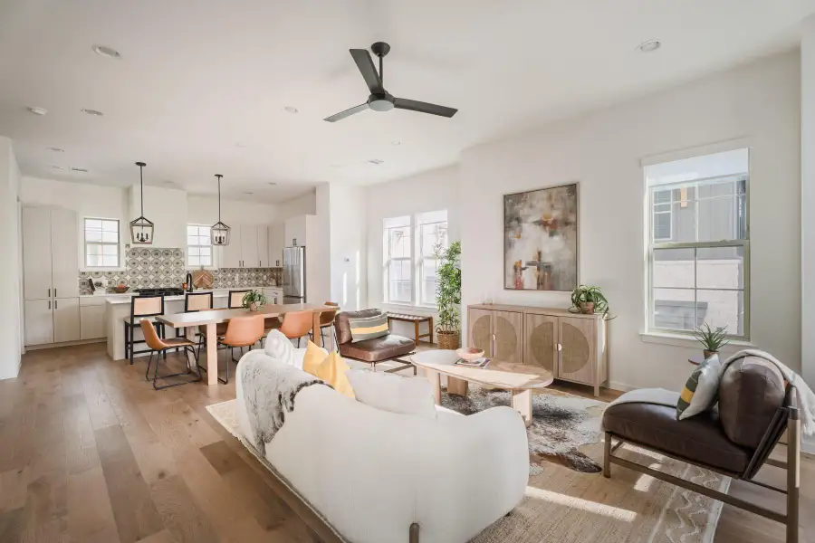 Living area featuring light wood-style floors, recessed lighting, and a ceiling fan