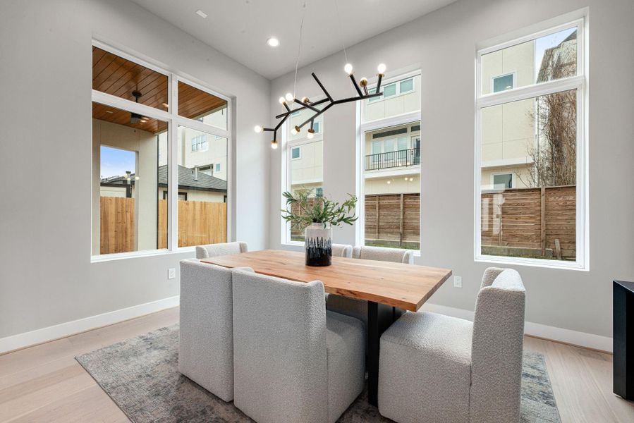 Elegant dining area situated perfectly between the kitchen and living room Elegant dining area situated perfectly between the kitchen and living room