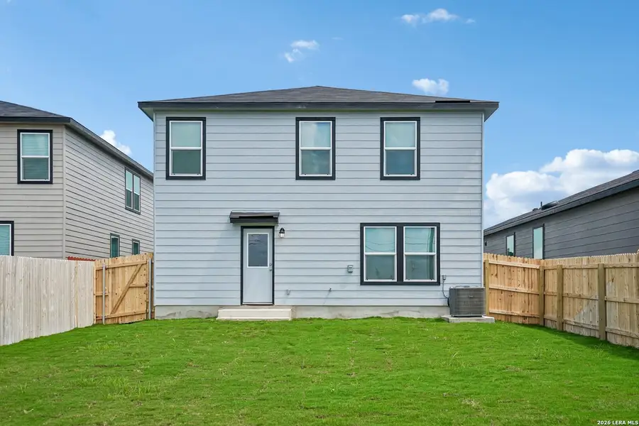 Exterior details and patio area of a home in Medina Crossing, Von Ormy (Image 4).