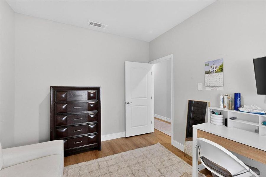 Home office featuring light wood finished floors and baseboards Home office featuring light wood finished floors and baseboards