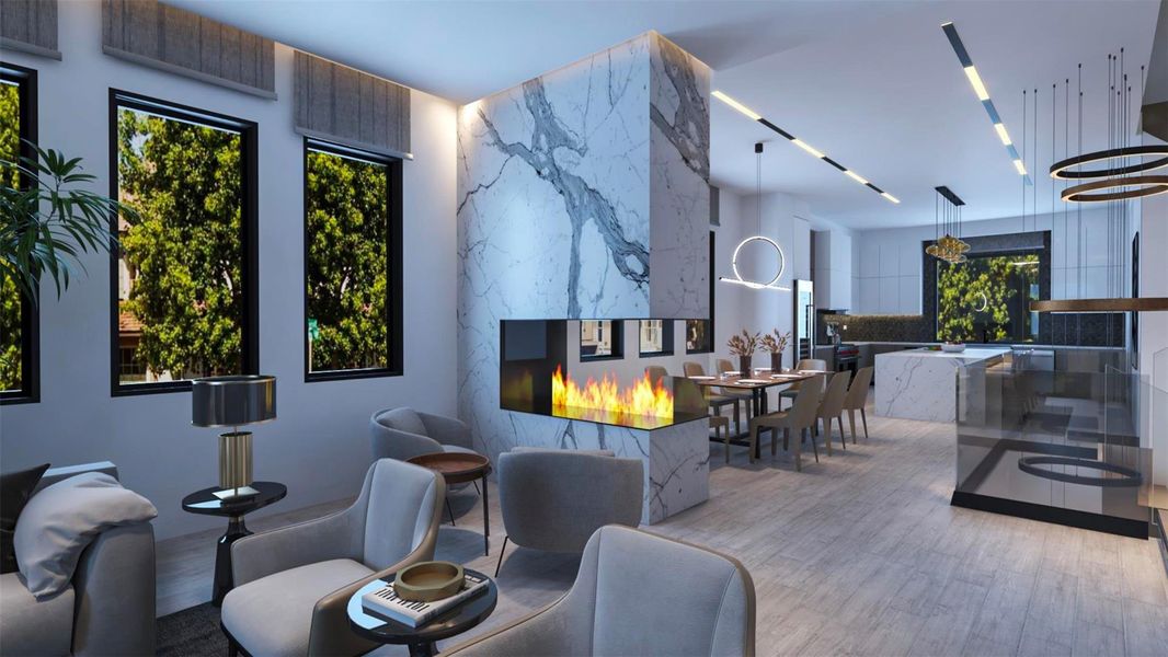 This modern open-concept living space features a sleek, marble-accented double-sided fireplace, large windows with lush green views, and contemporary furnishings. The dining area and kitchen are seamlessly integrated, highlighted by stylish lighting and a minimalist design. Virtually staged. This modern open-concept living space features a sleek, marble-accented double-sided fireplace, large windows with lush green views, and contemporary furnishings. The dining area and kitchen are seamlessly integrated, highlighted by stylish lighting and a minimalist design. Virtually staged.