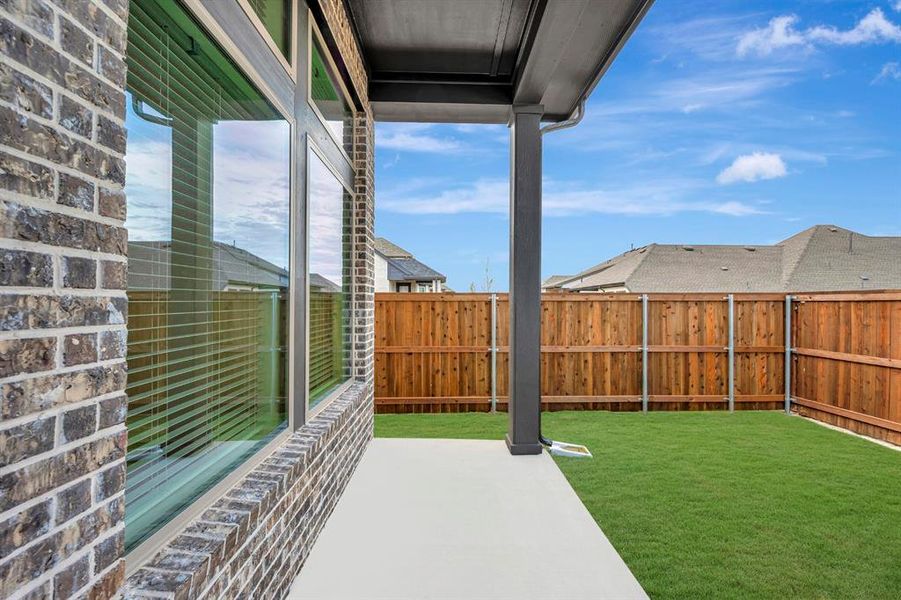 Exterior details and patio area of a home in Creekshaw – Gardens, Royse City (Image 3).
