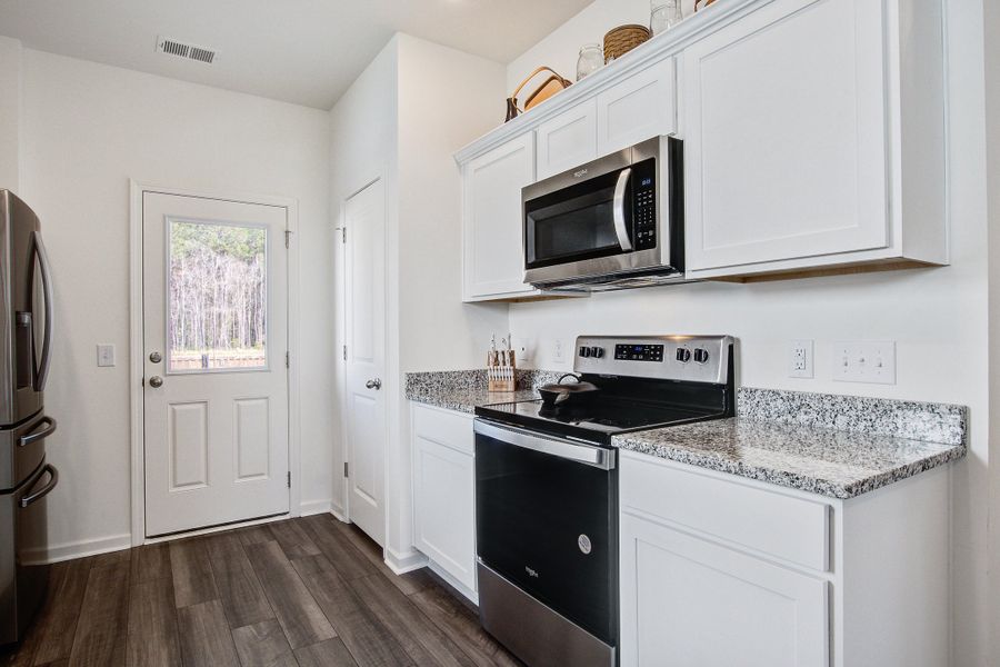 Furnished interior view inside a new home in Pender Woods at Cane Bay, Summerville (Image 8).